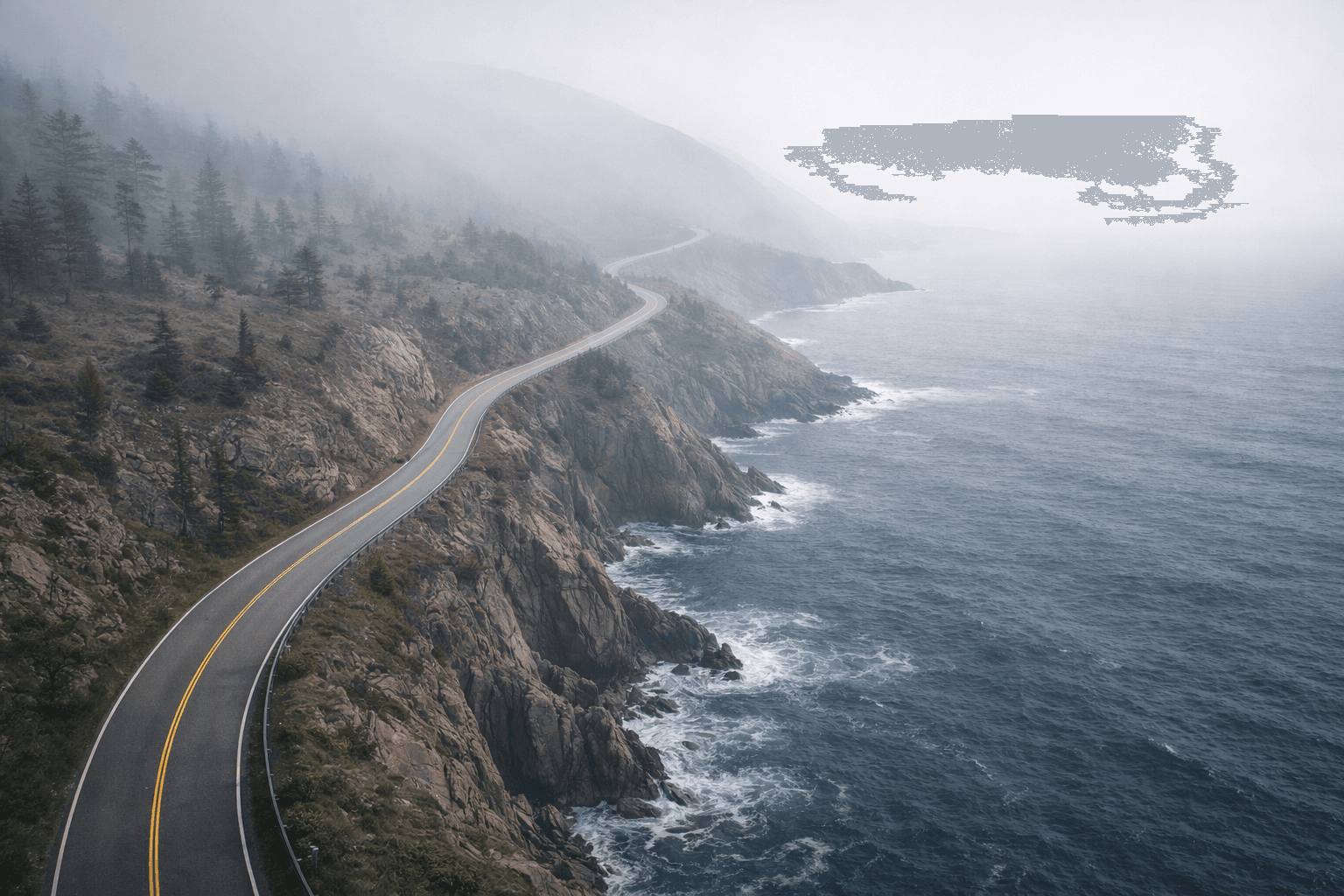 Coastal road winding along an ocean shoreline